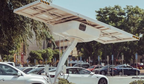 pexels-photo-9800030-9800030 Modern solar-powered charging station for electric vehicles on a sunny day.
